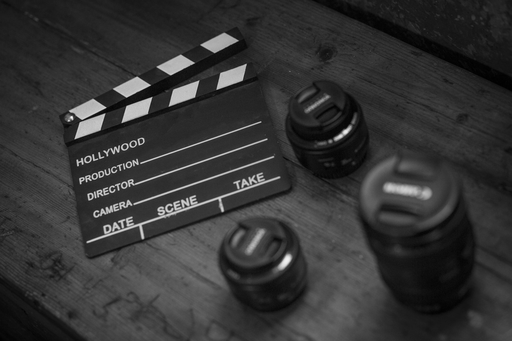 MUSCIdise™ About - Clapperboard and camera lenses.
